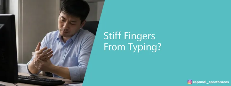 Sore, stiff fingers from typing? An office worker massaging his fingers at the computer