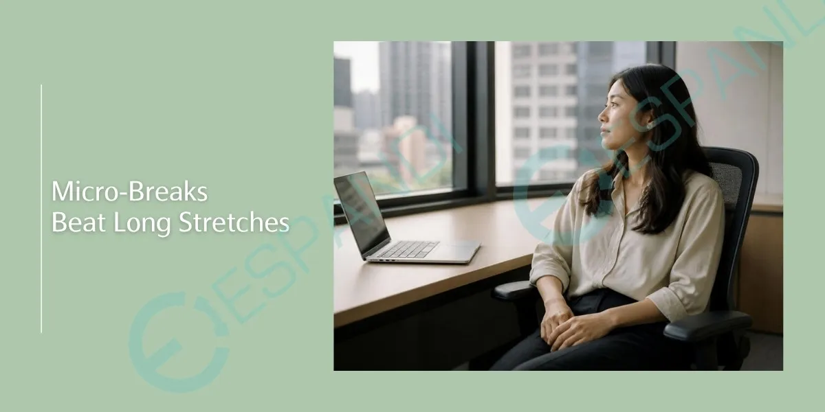 Micro-breaks beat long stretches: an office worker resting her hands away from the keyboard